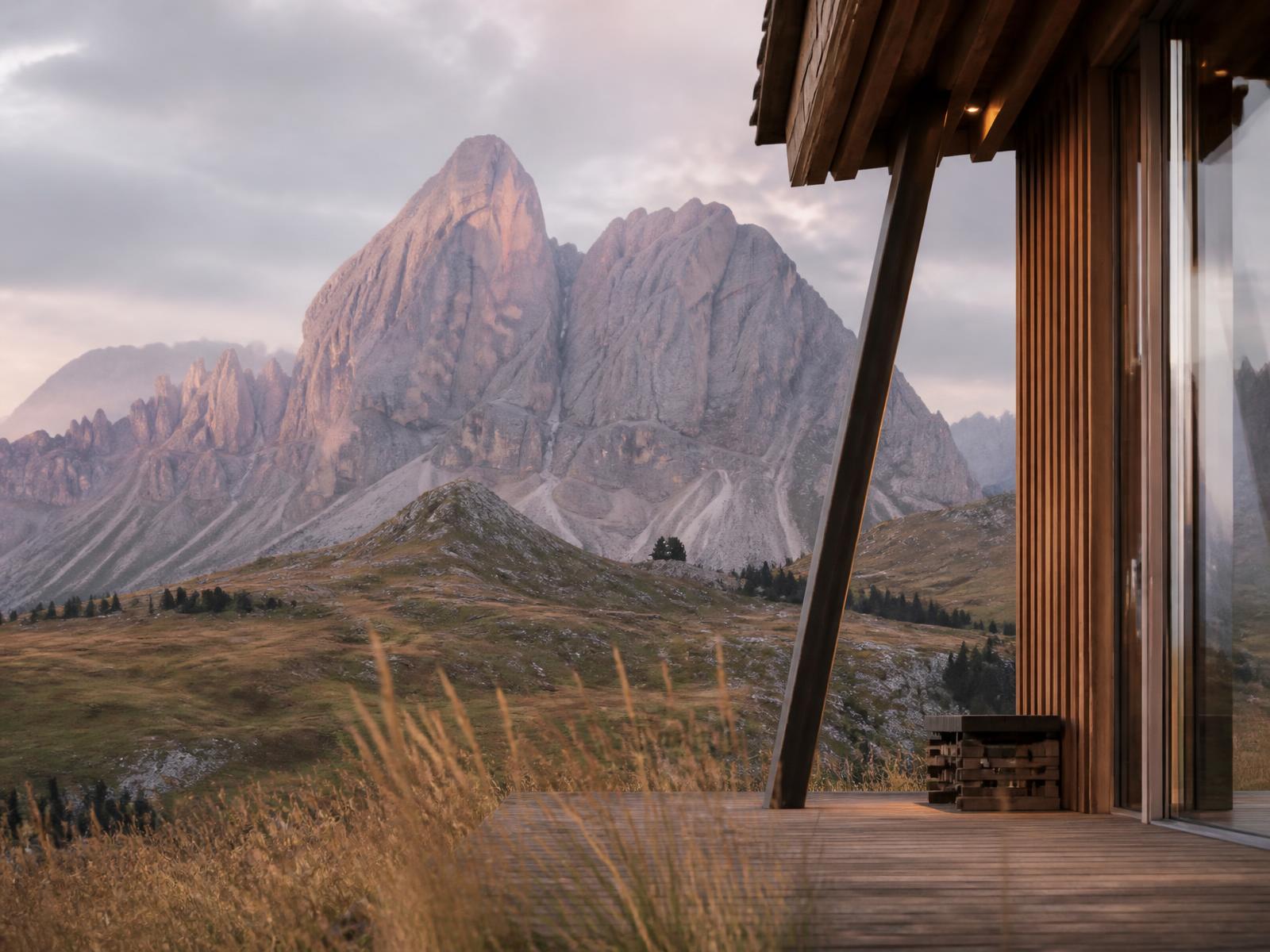 Timber and glass alpine lodge terrace facing limestone Dolomite peaks in pink dawn light