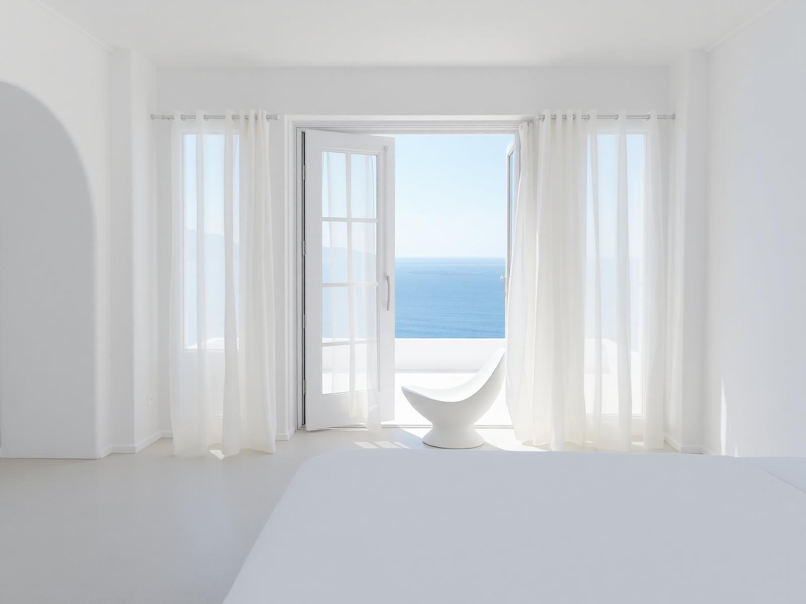 White island suite opening onto the sea through sheer drifting curtains