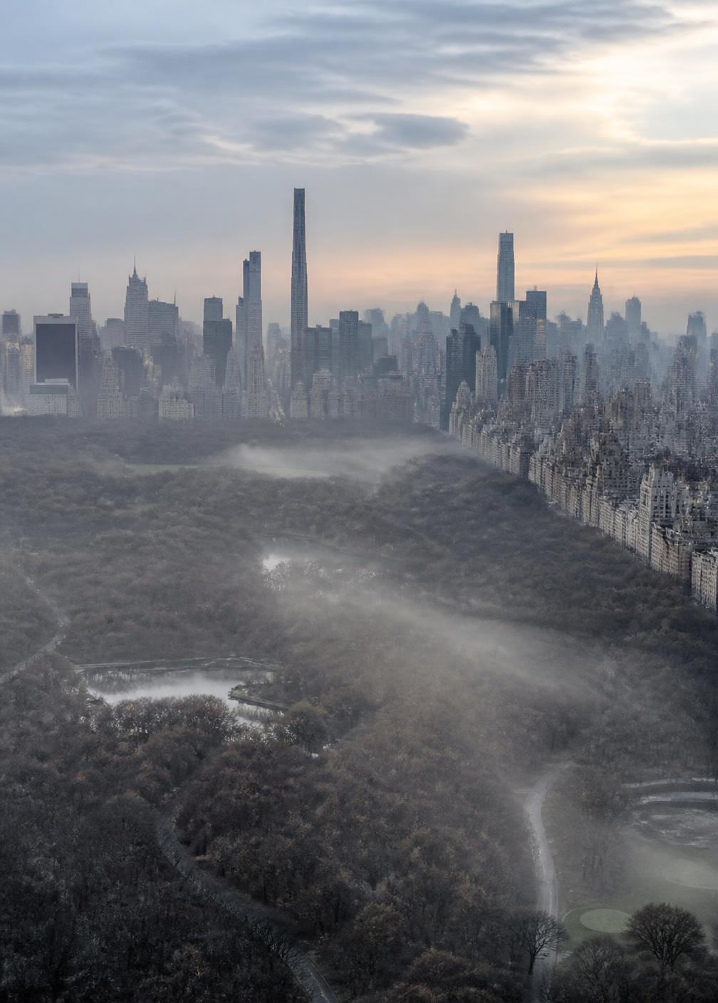 Central Park at dawn in late autumn seen from high above Manhattan, mist lying over bare trees